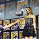 Taika Waititi hands Natalie Portman Thor's hammer in front of Kevin Feige and Chris Hemsworth on-stage at 2019's San Diego Comic-Con.